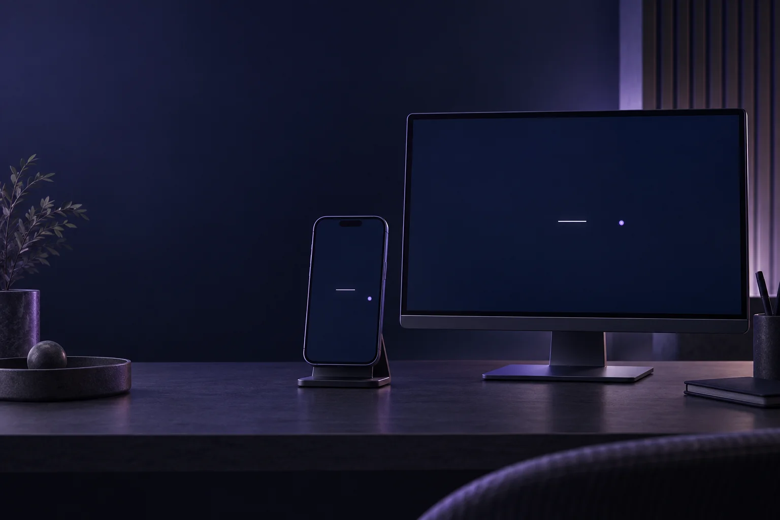 A supported phone and desktop monitor on a dark desk, each displaying a central line and an offset dot.